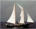 Complete with fisherman staysail, she looks her traditional best on a summer afternoon, full crew aboard.